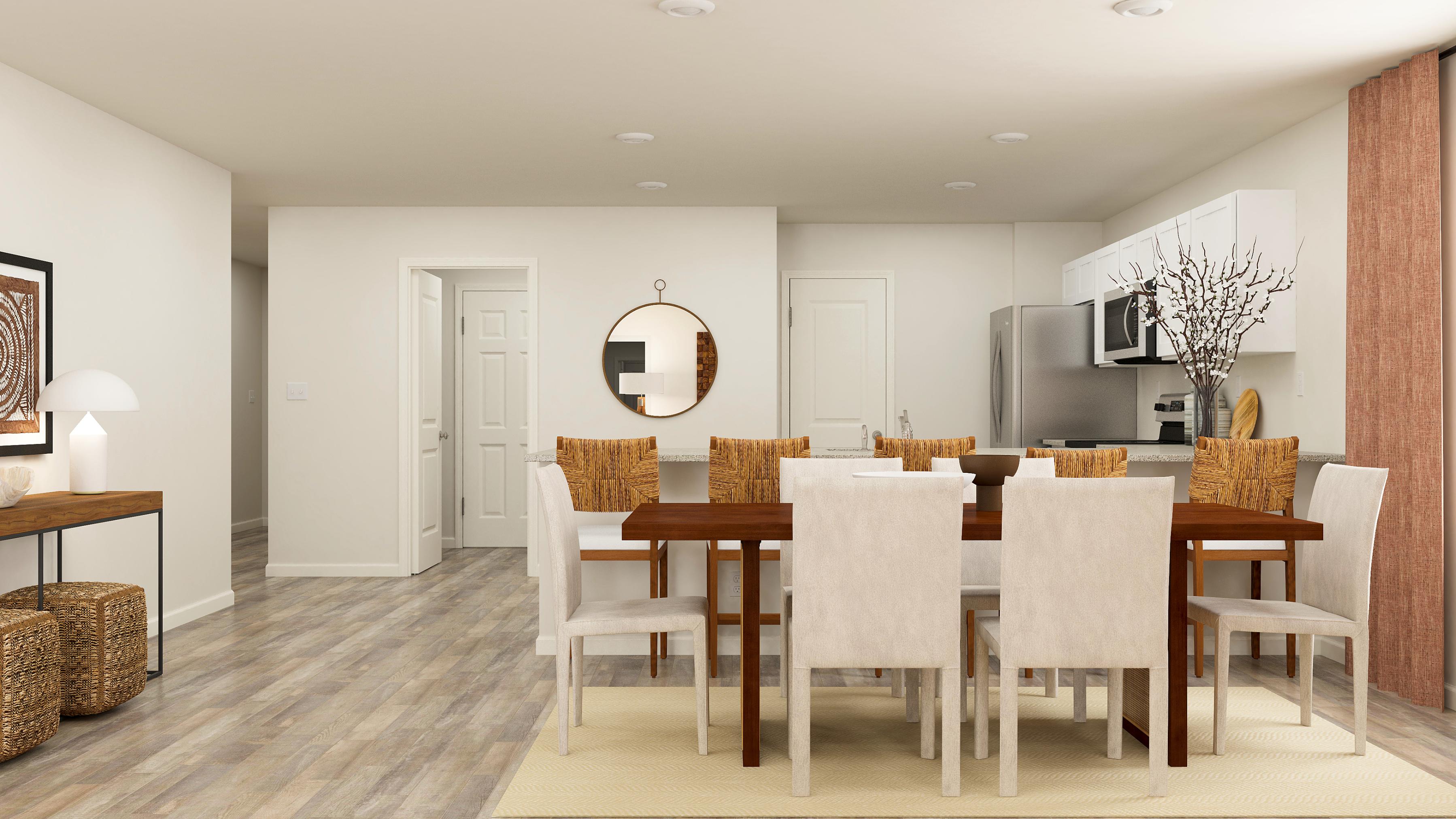 A dining room with a large table.