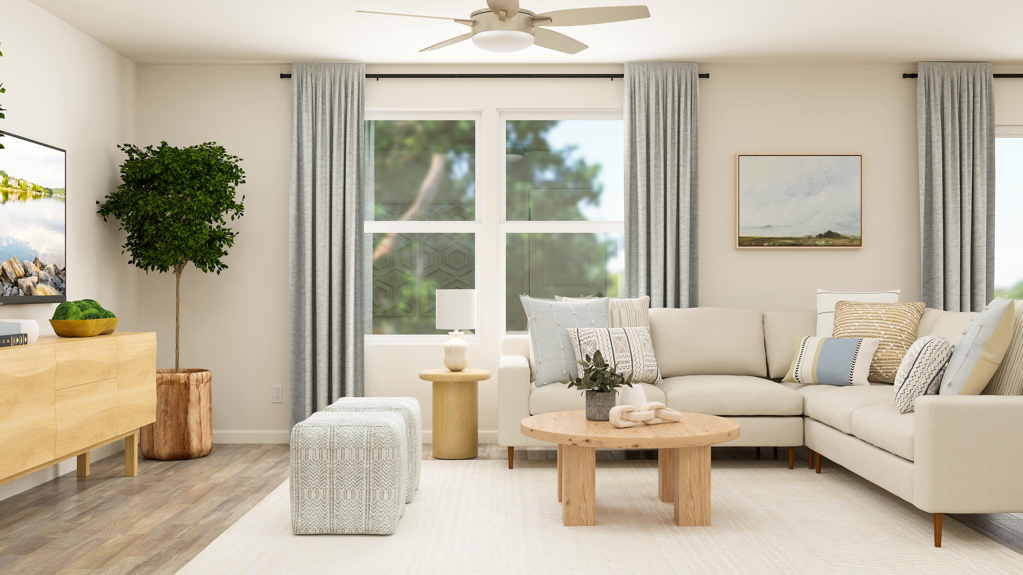 A living room with a white couch and a table.
