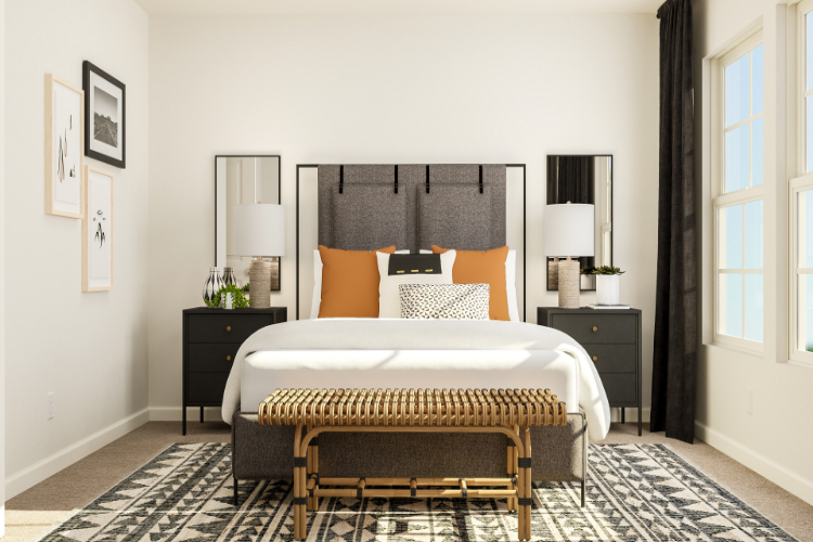 A bedroom with a bed and lamps.