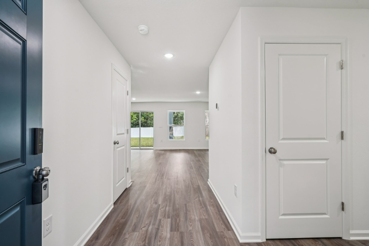 A hallway with white doors.