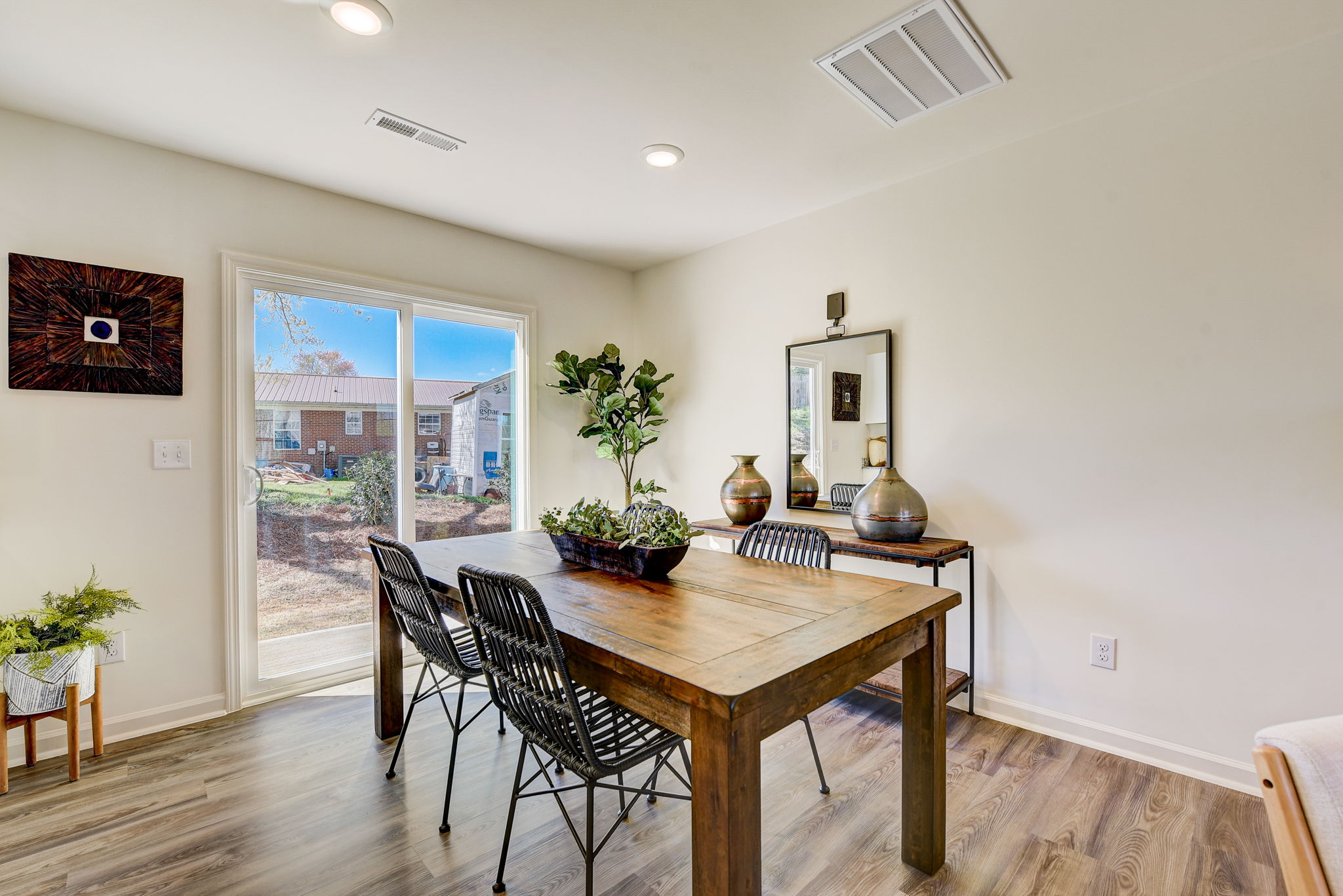 A dining room table with chairs.