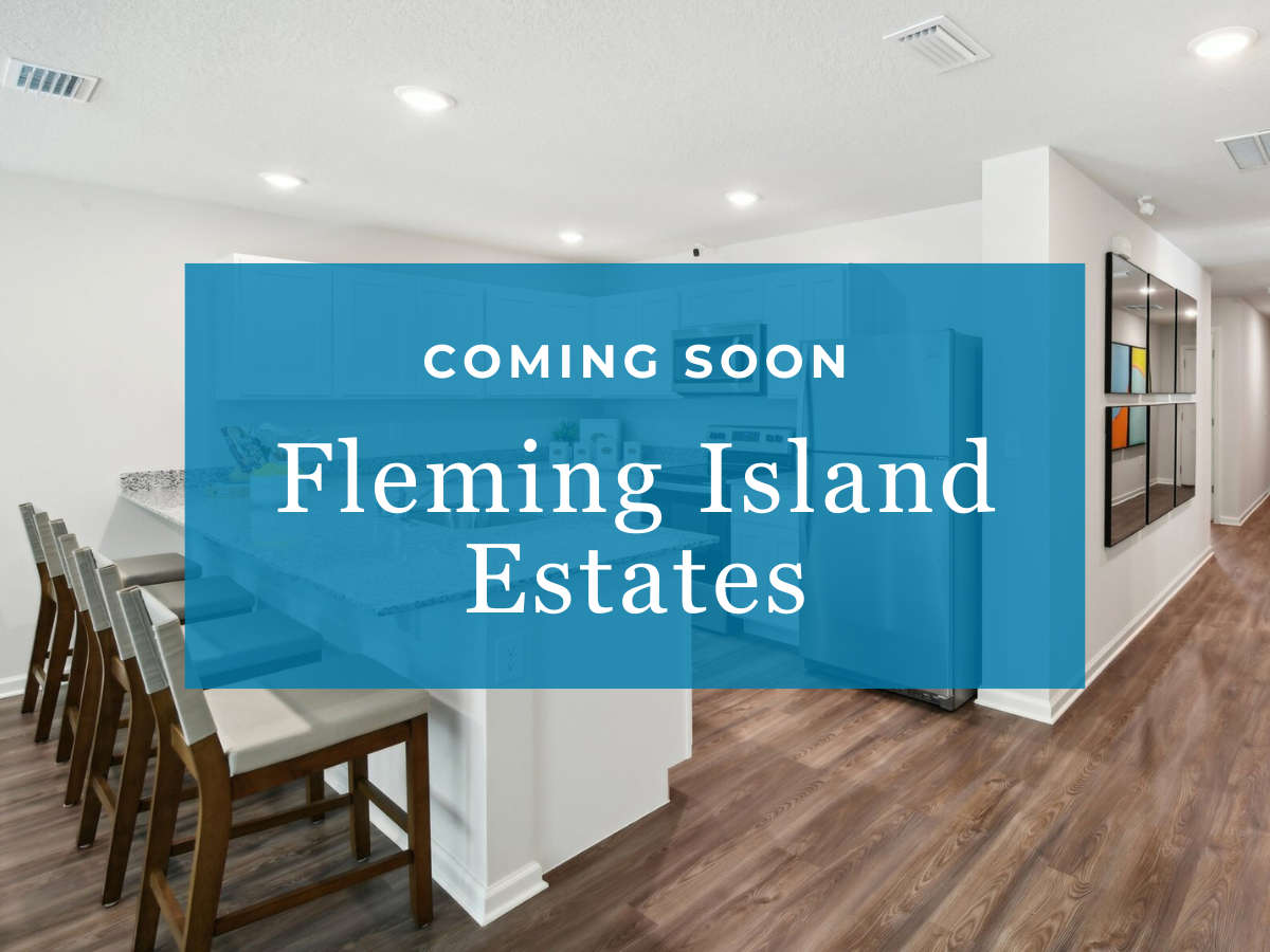 A room with chairs and a blue wall with white text.