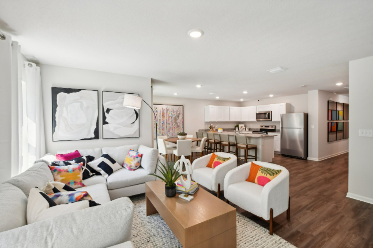 A living room with a wood floor.