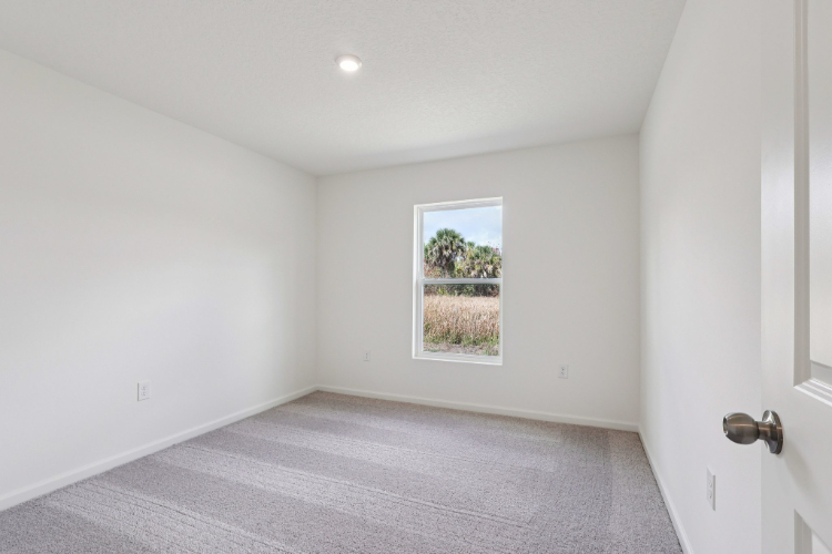 A room with a window and a door.