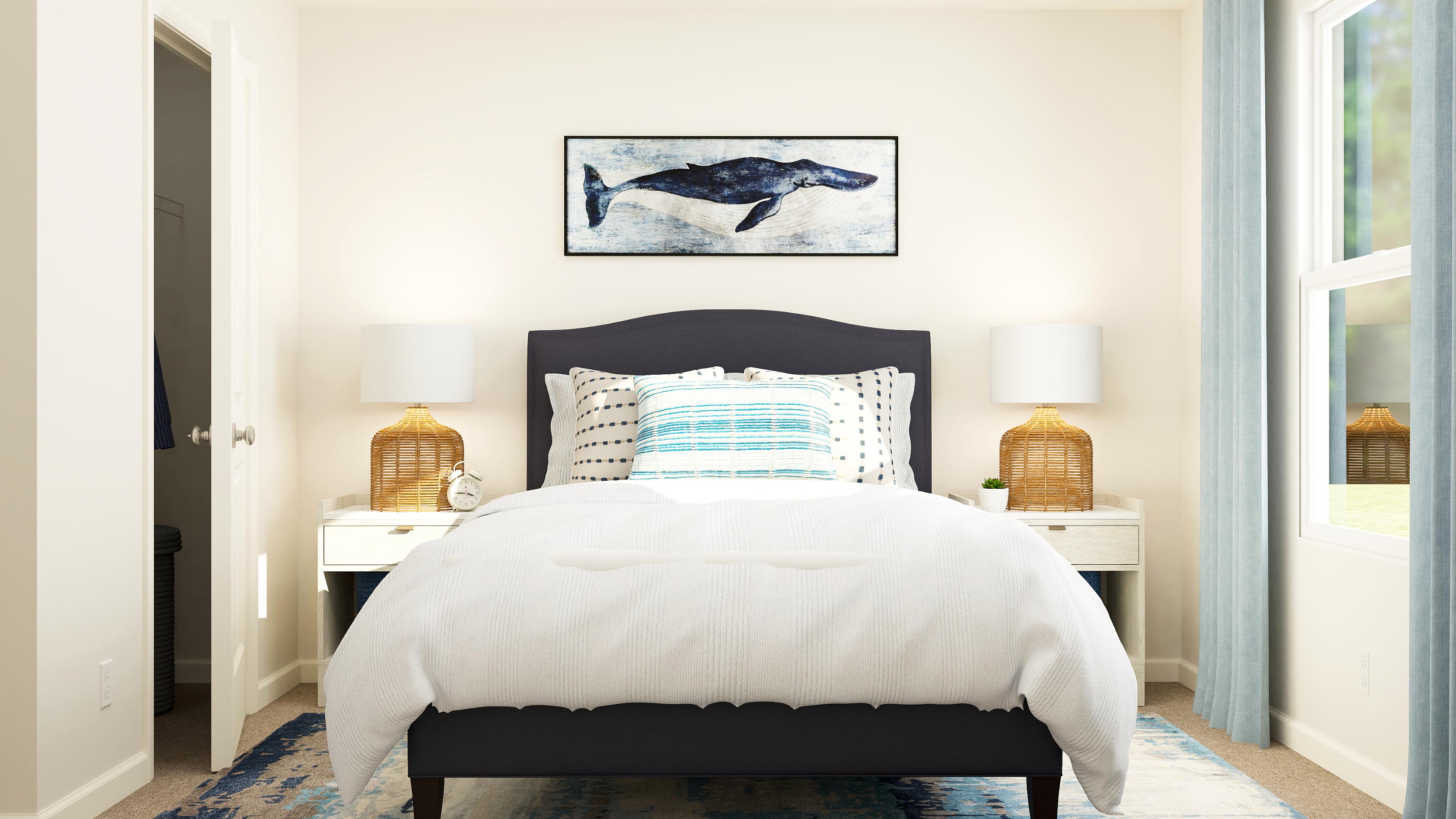 A bed with a white bed spread.