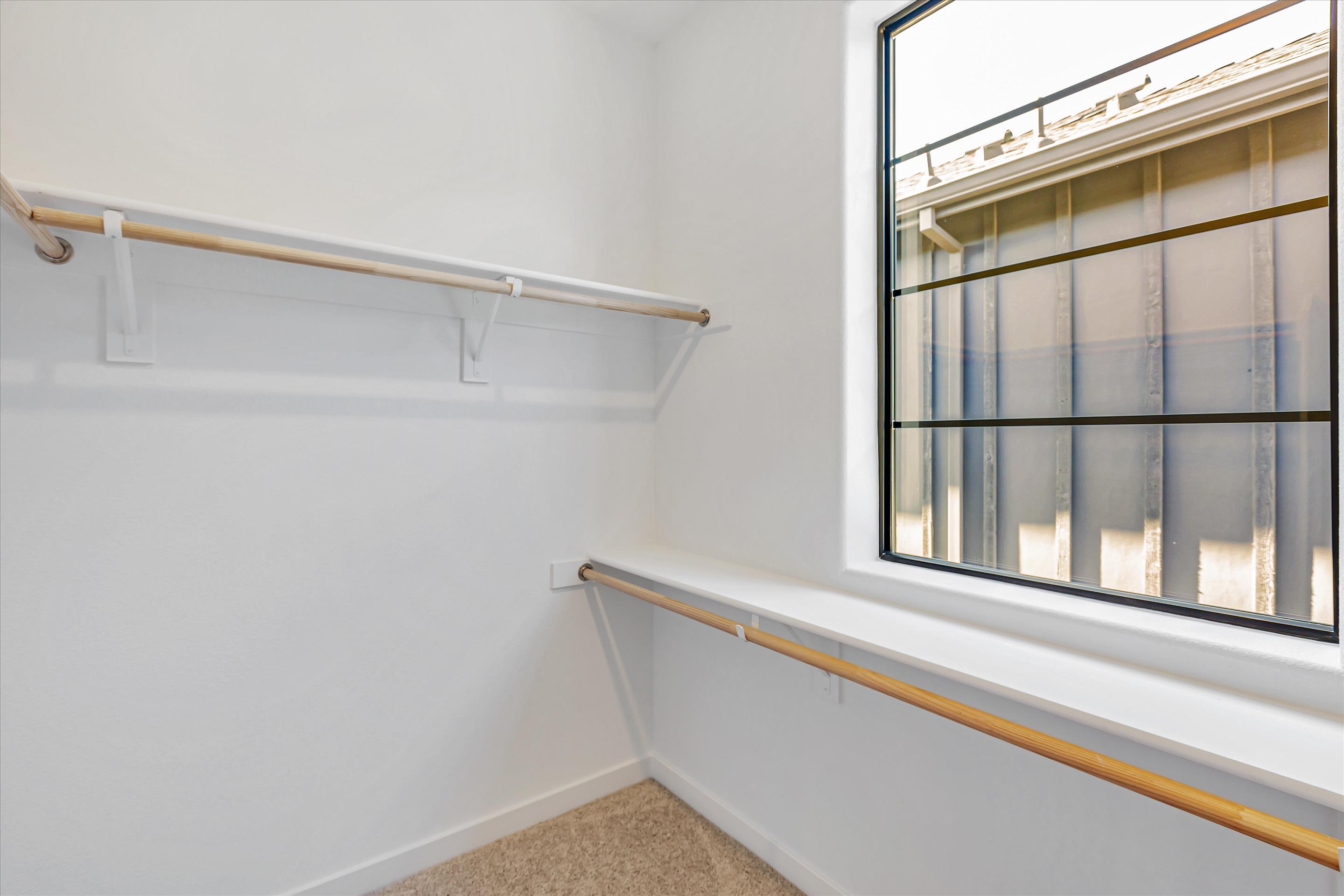 A white staircase with a window.